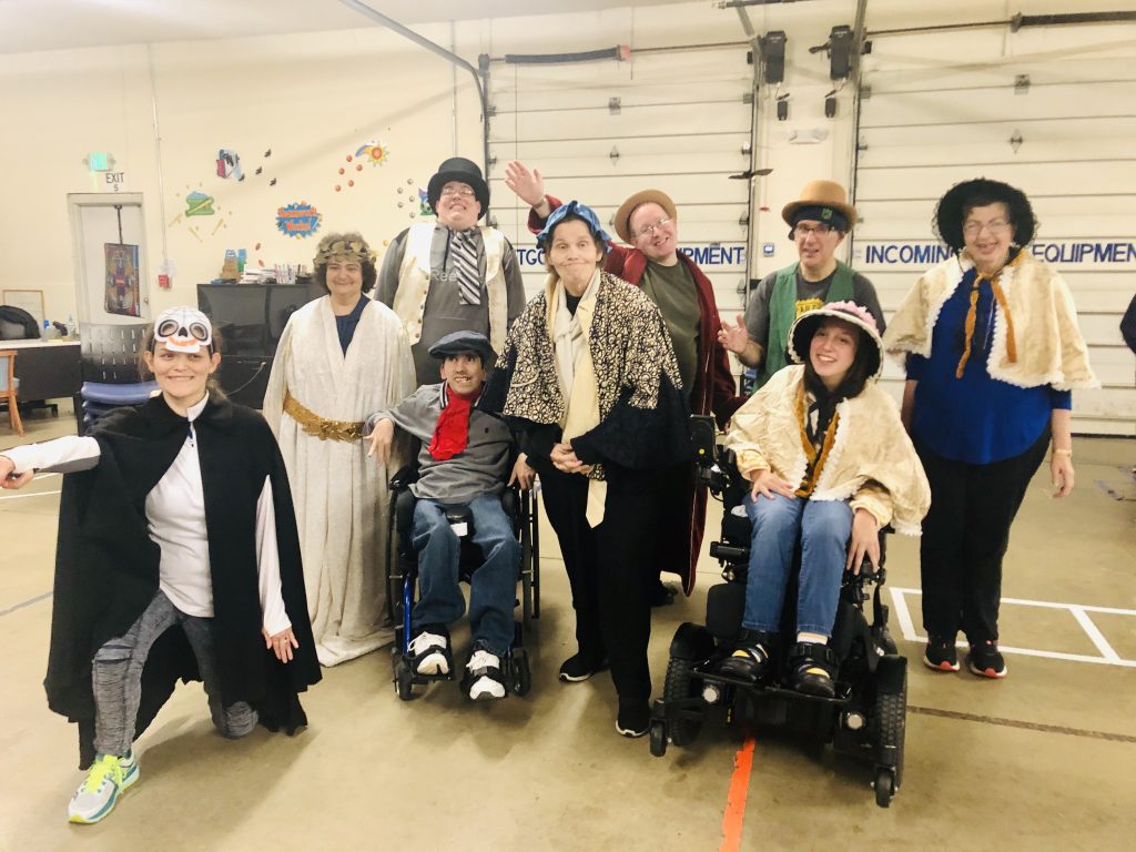 Students of L.I.F.E. Adult Day Academy pose in costume for A Christmas Carol